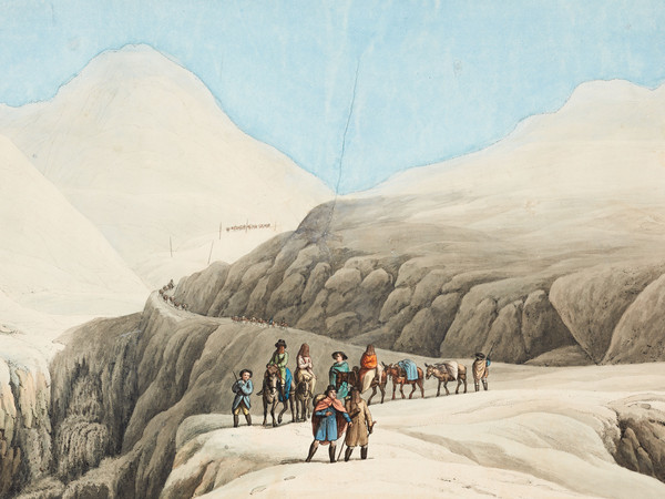 Gruppo di viaggiatori sulla strada innevata del passo del San Gottardo