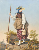 Ragazza con vestito tradizionale dell’Oberhasli con velo, cappello di paglia, bastone da montagna e secchio del latte, in cammino su un suolo roccioso
