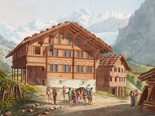 Gasthof in Grindelwald. Im Vordergrund eine Reisegruppe, im Hintergrund Gebirge.